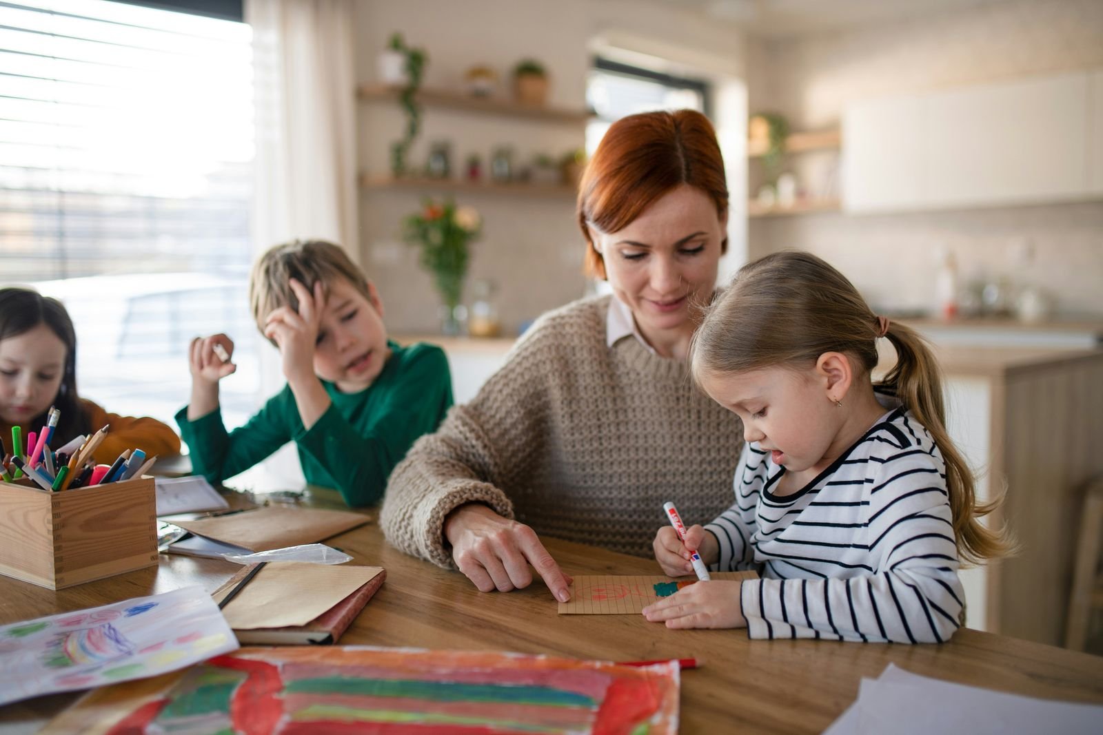 A family sits together around their kitchen table